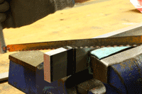 Candidates make a v-block on the engineering fitting skills course